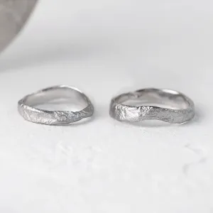MUSK irregular gold wedding bands shown separately with textured surfaces