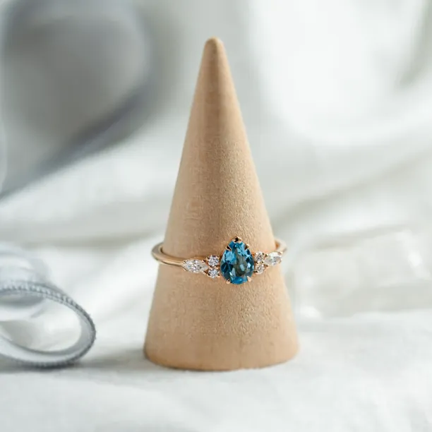 Gold ring with topaz and moissanites ASTROS Image
