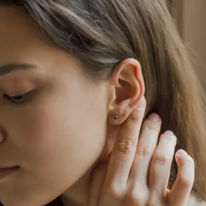ANISE salt and pepper diamond earring worn on the ear