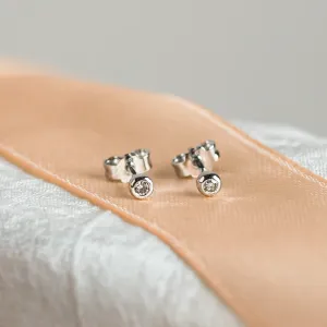 Pair of ANISE salt and pepper diamond earrings, shown from an angled view