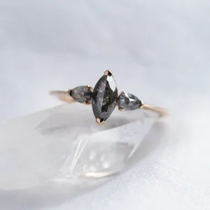 Close-up of the RHEA vintage ring with three salt and pepper diamonds