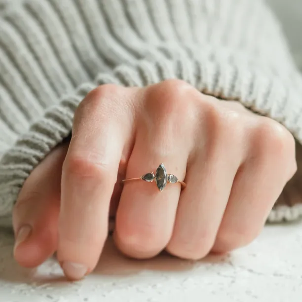 RHEA vintage engagement ring with salt and pepper diamonds shown on a hand