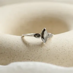 Angled view of the RHEA ring showing its three salt and pepper diamonds