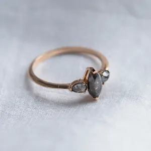 Side view of the RHEA ring with a central marquise and two pear-shaped diamonds