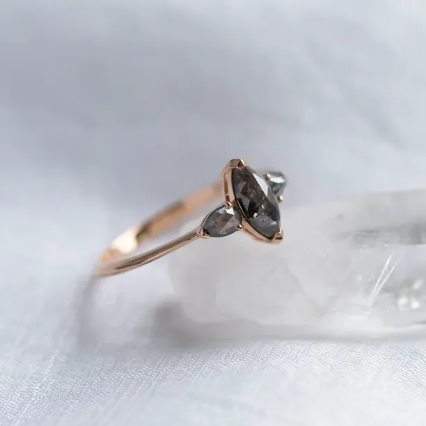 Close-up of RHEA vintage engagement ring with salt and pepper diamonds