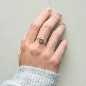 AGNES gold ring with a salt and pepper diamond worn on a finger