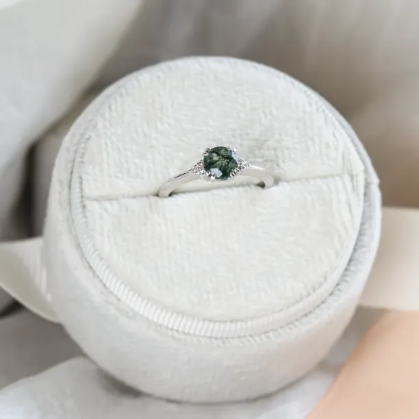 Close-up of the moss agate and diamond engagement ring