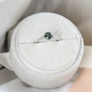 Close-up of the moss agate and diamond engagement ring