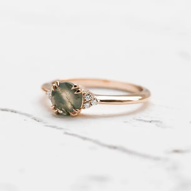 Side view of the moss agate and diamond engagement ring