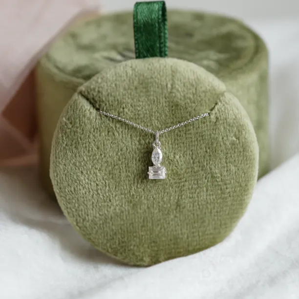 LYON moissanite necklace displayed on a jewelry stand