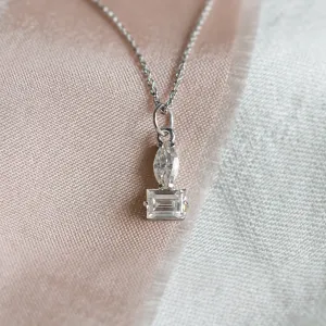 Close-up of the LYON necklace pendant with marquise and baguette moissanites