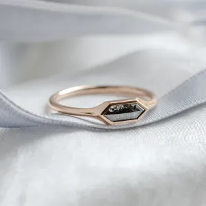 Angled close-up of the gold hexagon salt and pepper diamond ring