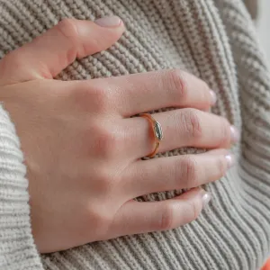 Hexagon salt and pepper diamond engagement ring worn on a finger