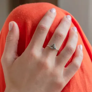 HERO gold ring with a superman salt and pepper diamond worn on a hand