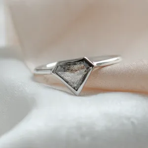 Close-up of the geometric HERO gold ring with a superman salt and pepper diamond