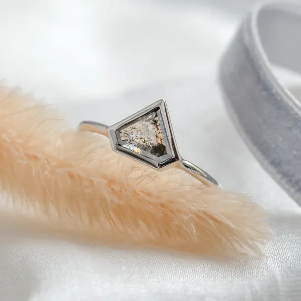 Close-up of the HERO gold ring with a superman salt and pepper diamond