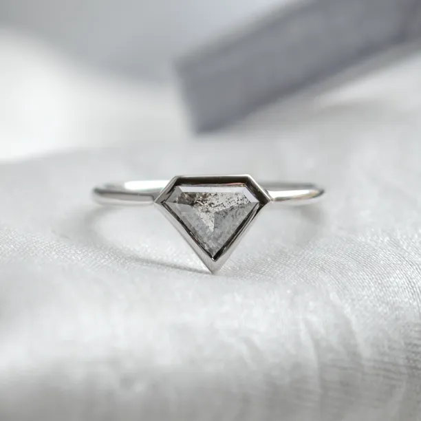 HERO gold ring with a superman salt and pepper diamond, close-up