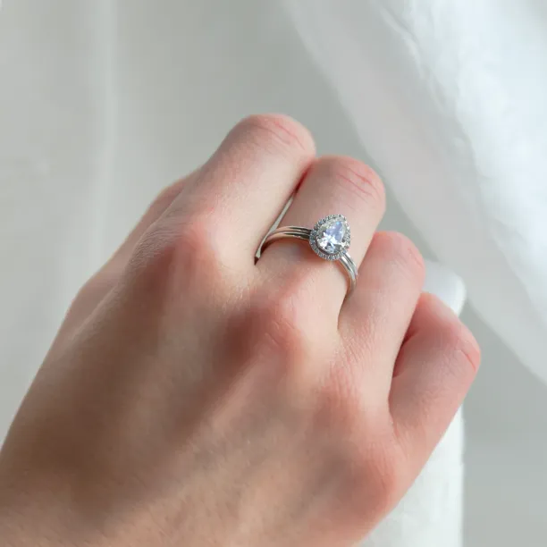 KIMBER pear-shaped moissanite engagement ring worn on the hand