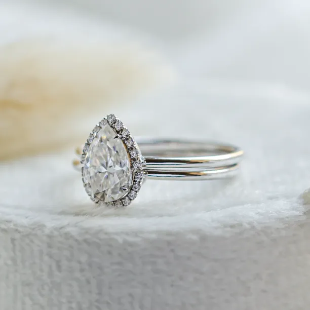Angled close-up of the KIMBER pear-shaped moissanite engagement ring
