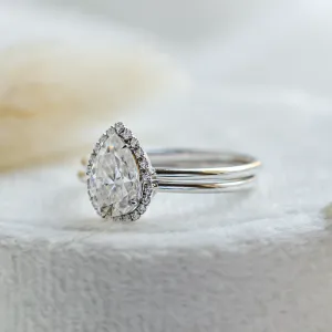 Angled close-up of the KIMBER pear-shaped moissanite engagement ring