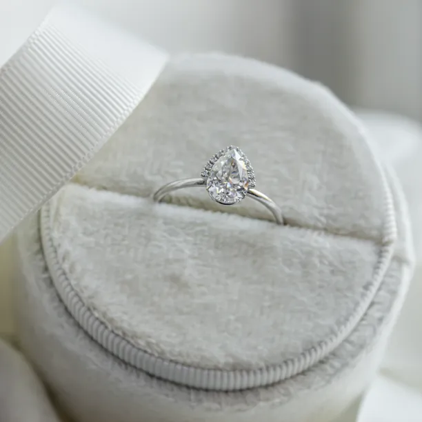 KIMBER pear-shaped moissanite engagement ring in a ring box