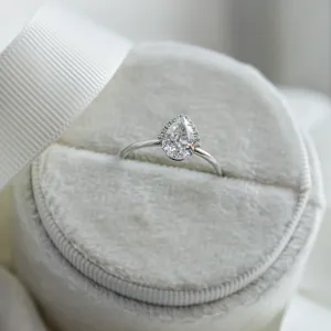 KIMBER pear-shaped moissanite engagement ring in a ring box