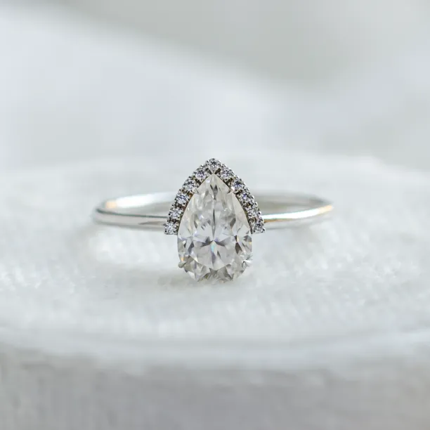 KIMBER engagement ring from a moissanite set with pear-shaped center stone