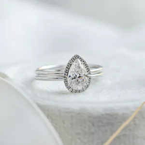 Close-up of the KIMBER engagement ring with pear moissanite and surrounding stones