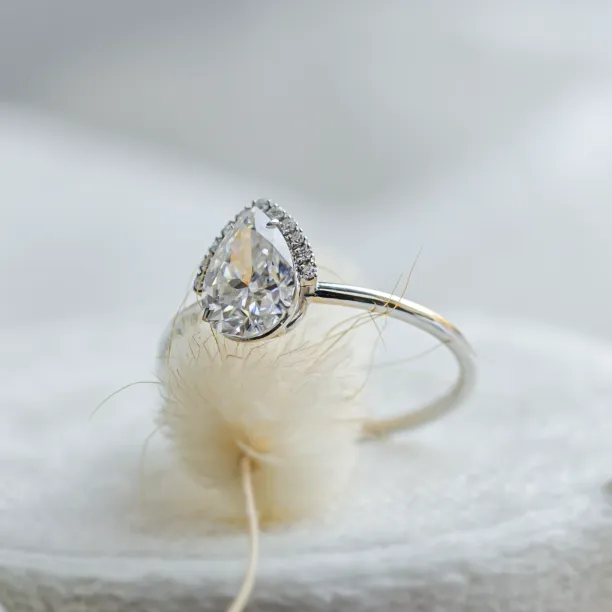 Angled view of the KIMBER engagement ring with pear moissanite