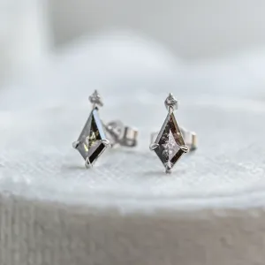 Close-up of gold POE earrings with kite salt and pepper diamonds
