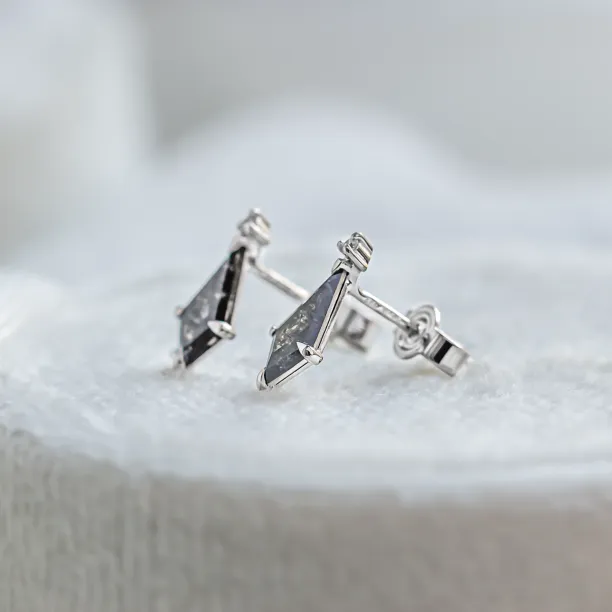 Angled view of gold POE earrings showing the posts and earring backs