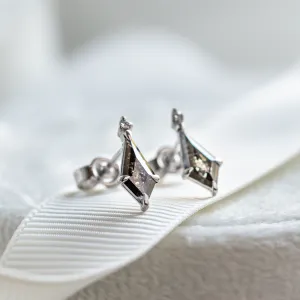 Angled pair of gold POE earrings with kite salt and pepper diamonds