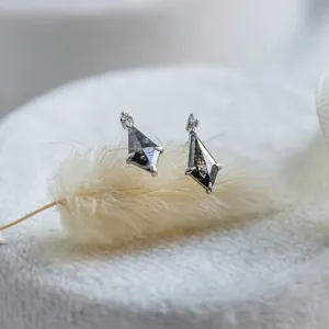 Gold POE earrings with kite salt and pepper diamonds in an angled view