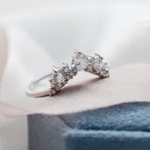 Side-angled view of the curved FIESTA wedding ring with diamonds
