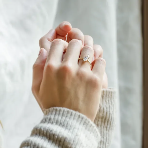 Gold SALEM ring with hexagon moissanite worn on the hand