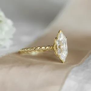 Angled view of the gold SALEM ring with hexagon moissanite
