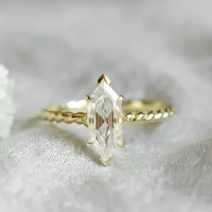 Close-up of the gold SALEM ring with hexagon moissanite