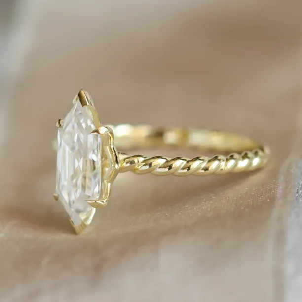 Side detail of the gold SALEM ring with hexagon moissanite