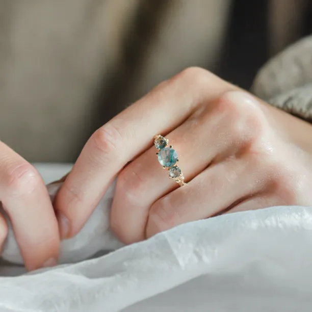 BACCHUS moss agate ring worn on a hand