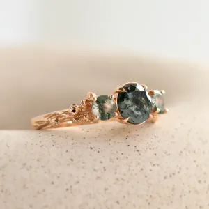 Angled view of the BACCHUS ring with green moss agate details