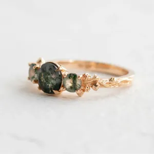 Angled side view of the BACCHUS ring and its moss agate setting