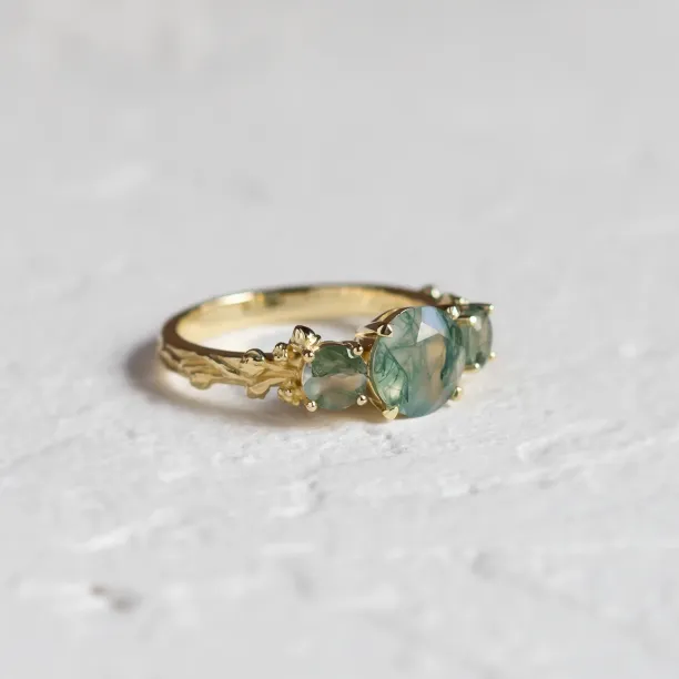 Angled view of the gold BACCHUS ring with green moss agate