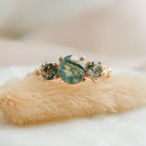 Close-up of the BACCHUS ring with a central round green moss agate