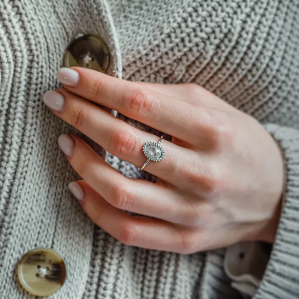 RIDLEY salt and pepper diamond halo ring worn on the hand