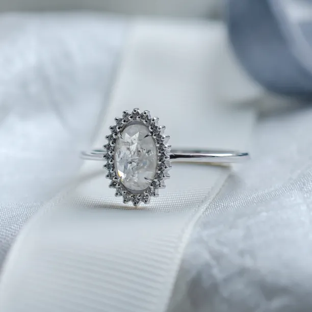 Angled view of the RIDLEY oval salt and pepper diamond ring