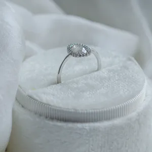 Side view of the RIDLEY halo engagement ring and oval diamond