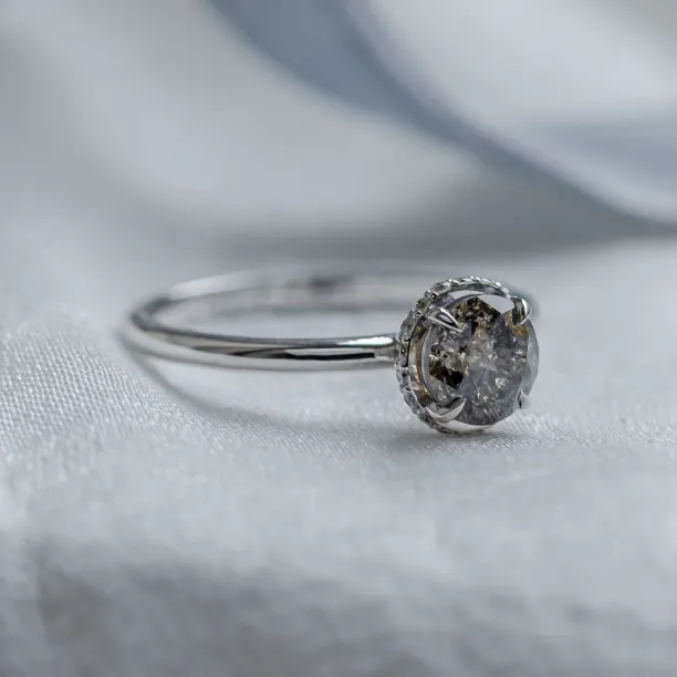 Angled view of the TANAQUIL engagement ring with salt and pepper diamonds