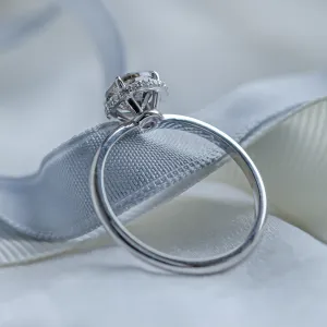 Angled detail of the TANAQUIL gold engagement ring with salt and pepper diamonds