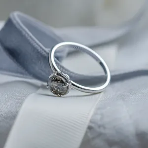 Angled view of the TANAQUIL gold engagement ring with a salt and pepper diamond