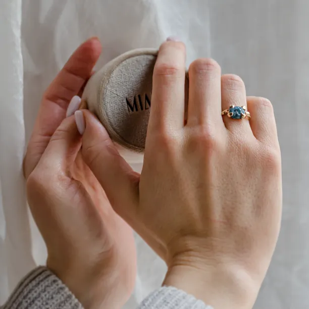 Gold ring with blue raw diamond and unusual rim SKY Image